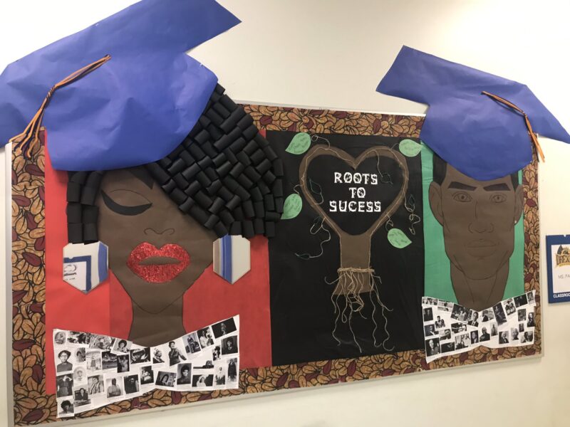 Black History Bulletin Board – Roots to Success Black History Month bulletin board ideas include this one. One side is a Black woman whose shirt is made up of photos of famous Black women. The other side is a Black man whose shirt is made up of photos of famous Black men.