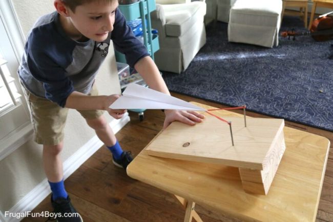 Sixth Grade Science: Plane Launcher Sixth grade science student using a homemade launcher to launch a paper airplane