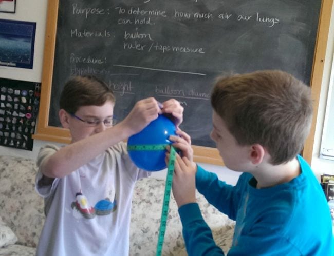 8th Grade Science Blog She Wrote Two eighth grade science students measuring the circumference of a blue balloon