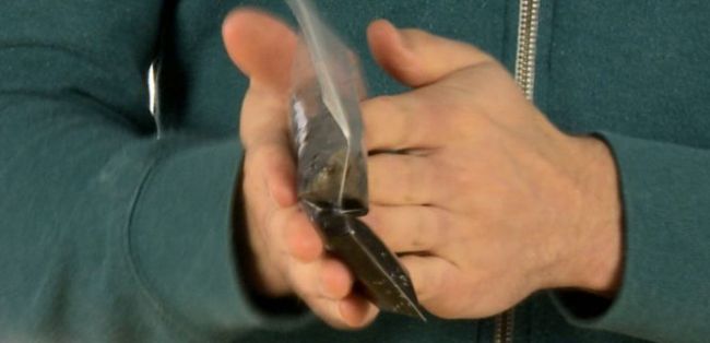 8th Grade Science Handwarmer Steve Spangler Man rubbing hands together with plastic bag of black liquid in between