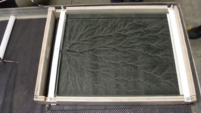 8th Grade Science Lichtenberg Lightning pattern made on piece of acrylic with photocopier toner