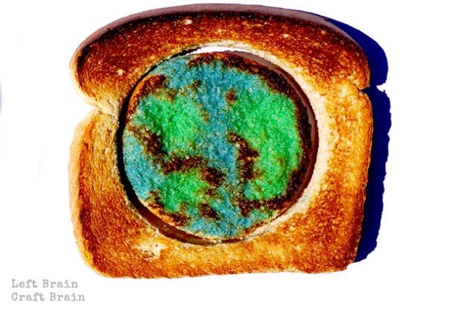 Climate Change Activities Left Brain Craft Brain Piece of toast with center section cut out and milk painted to resemble Earth (Climate Change Activities)