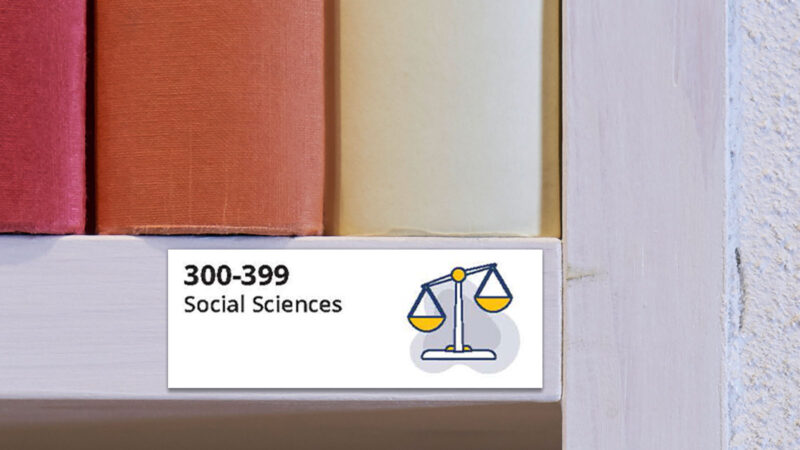 Dewey Decimal System Label Dewey Decimal System label for 300-399 Social Sciences on book shelf.