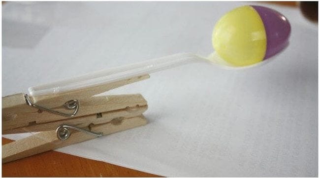 Easter Egg Activities Little Bins for Little Hands 3 Egg launcher for plastic eggs made of a clothespin and plastic spoon