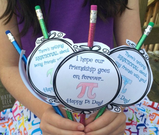 pi-day-cards A girl holds a set of pencils decorated with Pi cards attached as an example of Pi Day activities