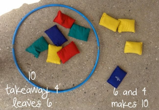 hula-hoop-subtraction A hula hoop and colored bean bags on the concrete
