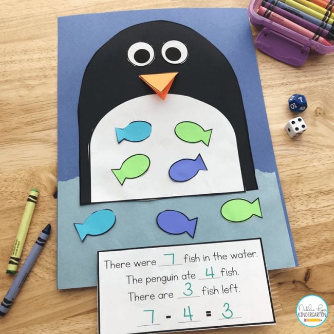 penguin-math Construction paper goldfish are placed in a construction paper penguin's belly as an example of subtraction activities