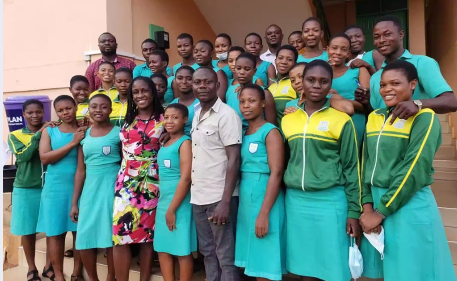 Teach Abroad Group of students standing with English teacher who is teaching abroad, as an example of summer professional development for teachers