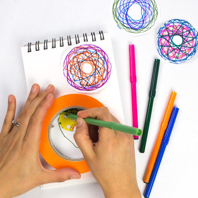 diy homemade spirograph toy (1 of 1) Hands working a DIY spirograph