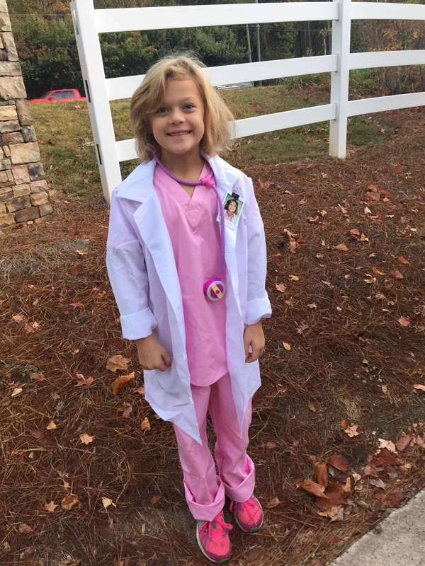 dress-up-mighty-girl child dressed up as a famous woman doctor for women's history month activity and idea