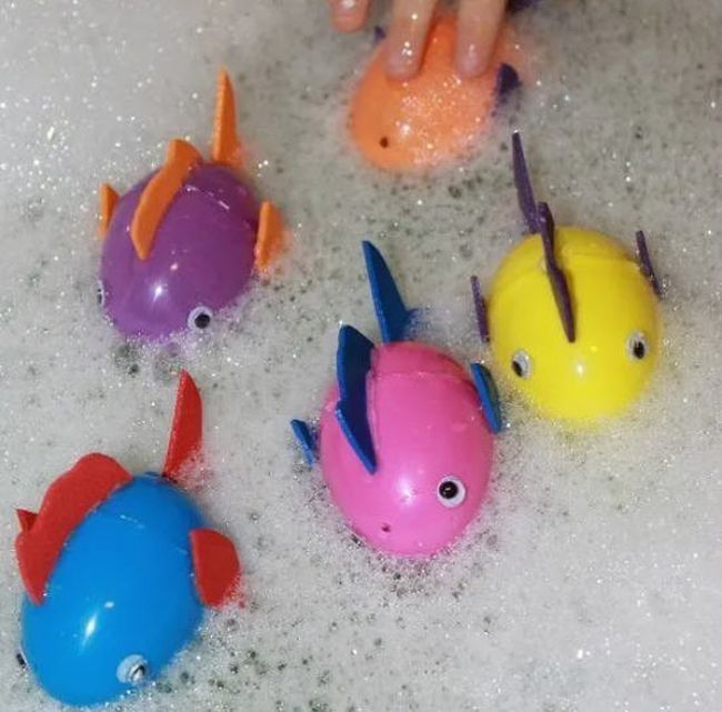 Easter Egg Activities: Floating Fish Floating fish made from plastic eggs in a tub of soapy water (Easter Egg Activities)