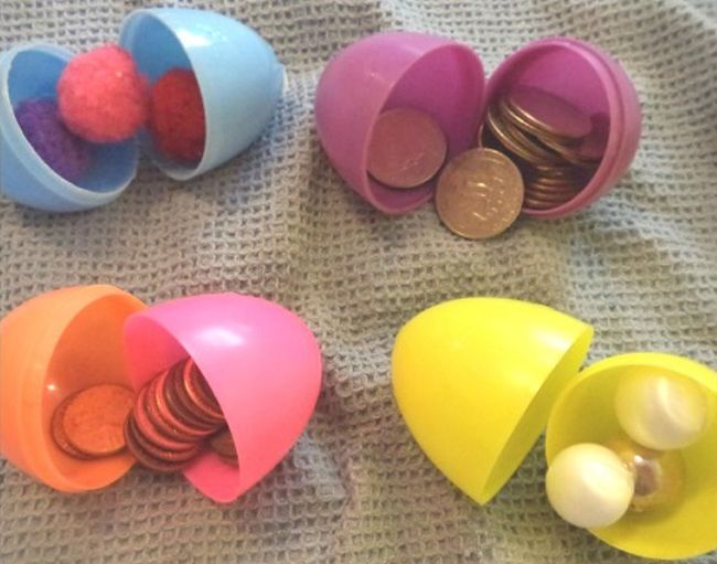 Easter Egg Activities; Sink an Egg Easter eggs filled with coins, pom poms, and other materials (Easter Egg Activities)