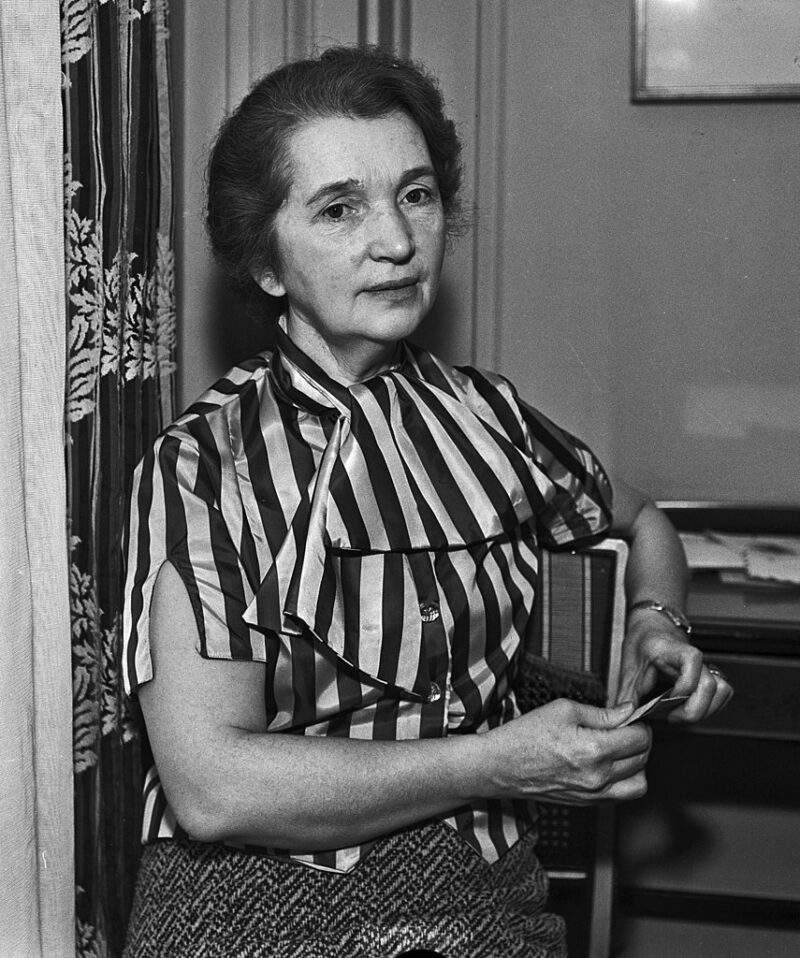 Famous Women in History Margaret Sanger, in a striped blouse, is seated with an envelope in her hand. Sanger, founder of the Birth Control League in New York, visited Los Angeles in late November and December 1928 and gave a series of talks advocating for better birth control access and education.