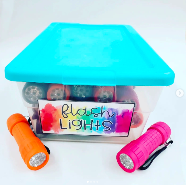 flashlights Two flashlights sit beside a storage with a turquoise lid labelled