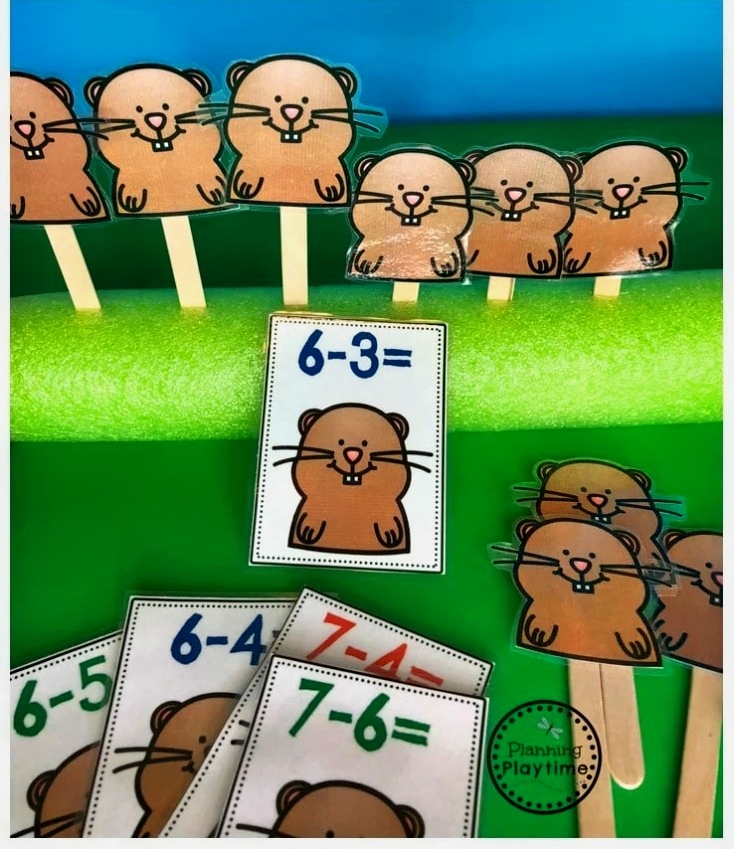 gophers Paper cut outs of gophers are glued to a craft stick and inserted into a pool noodle as an example of subtraction activities