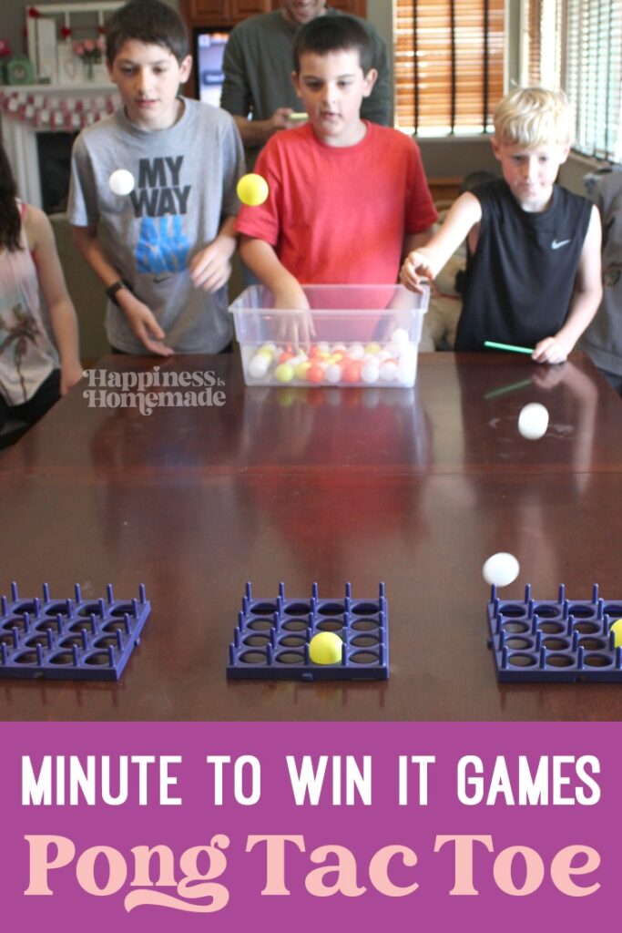 Pong Tac Toe Three kids are seen throwing ping pong balls into trays.