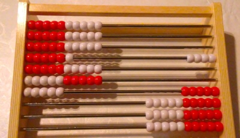 reknrek A rekenrek- a wooden frame with parallel dowels threaded with red and white beads