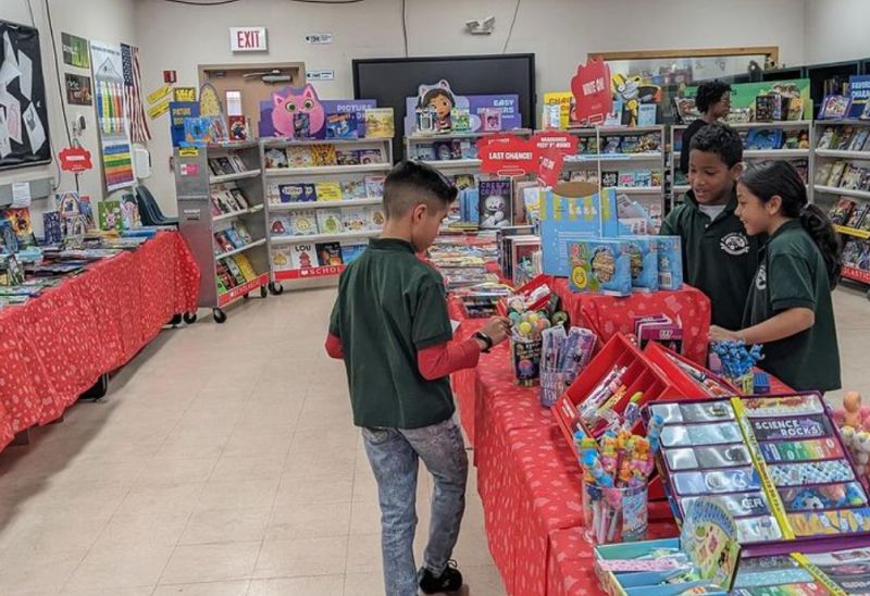 Scholastic School Book Fair Children browsing at a Scholastic school book fair