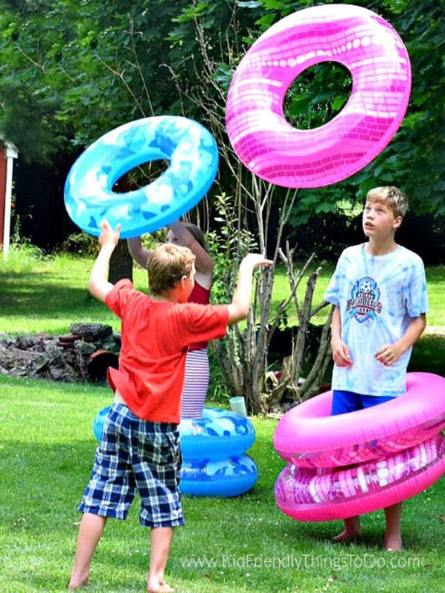 Tube Game Two boys are throwing inflatable tubes around each other in this example of minute to win it games.