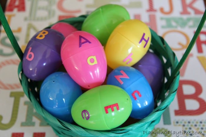 upperlowercase A basket of plastic eggs is shown. The upper case letter is on the top part of the egg and the lower on the bottom.