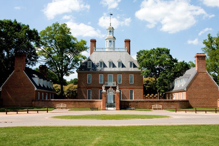 A view of the Governors Palace The Governor's Palace in Colonial Williamsburg, Virginia. A brick Colonial house with a courtyard, and former home of Thomas Jefferson.