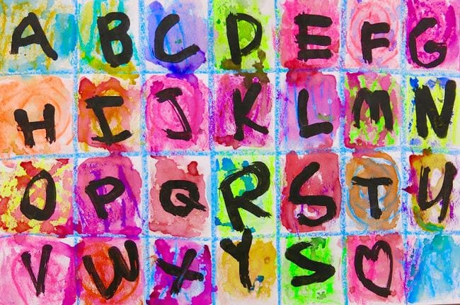Kindergarten Art Alphabet Art Paper divided into squares and painted different colors, with a letter of the alphabet in each square