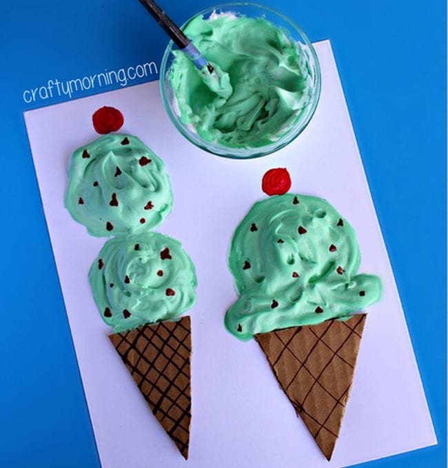 Kindergarten Art Crafty Morning Ice cream cone art is shown that looks like a mint chocolate chip ice cream cone. The ice cream portion is 3-D.
