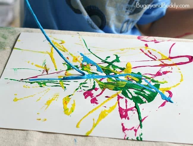 Kindergarten Art Buggy and Buddy 2 Paint is splattered on a white paper in this example of kindergarten art projects.