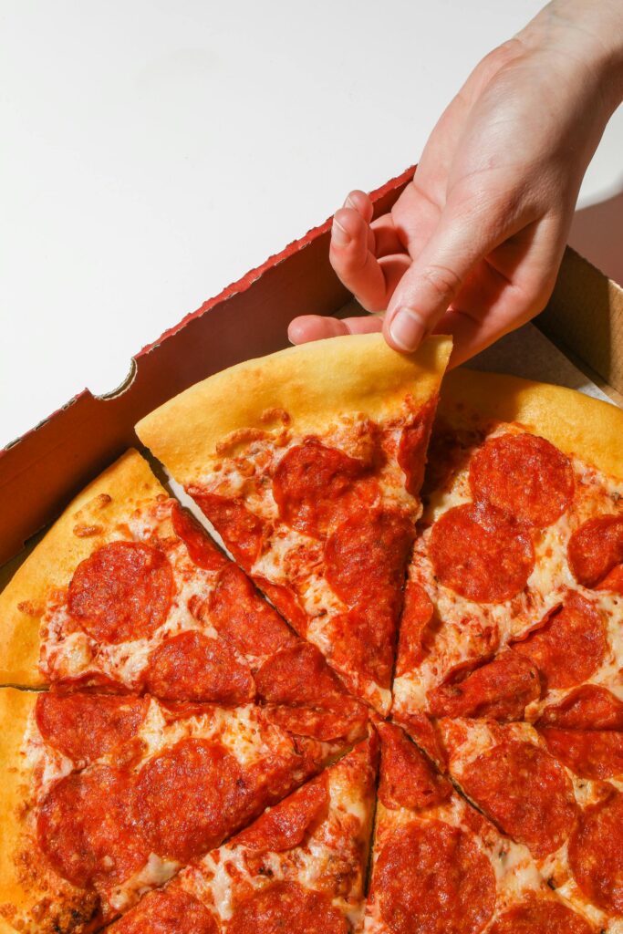 pizza pizza with a hand taking a slice for fraction activities