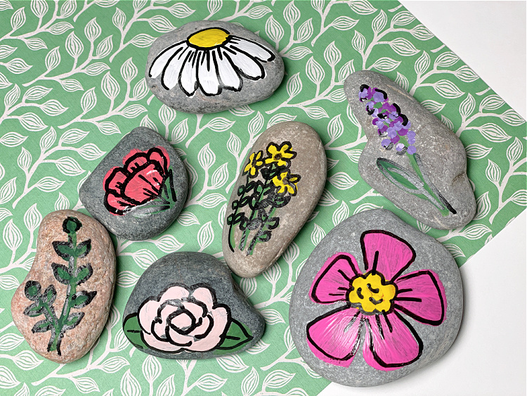 flower painted rocks Rocks with colorfully painted flower designs