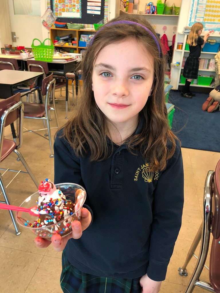 icecreamsundaeart A little girl is shown holding a sculpture of an ice cream sundae