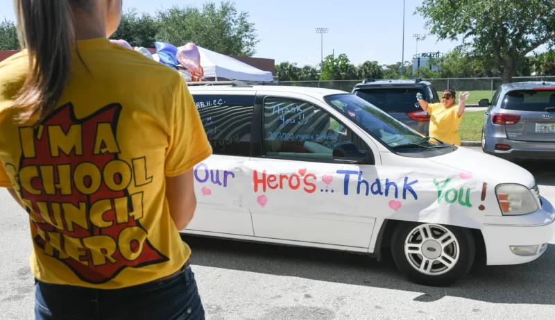 parade-school-lunch decorated car in a parade for national school lunch hero day