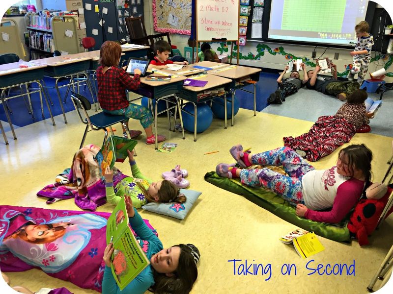 Read-a-Thon Activities Students lying on blankets on the floor of a classroom reading