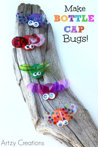 bottle-cap-bugs Colorful bugs made from bottle caps sit on a piece of driftwood as an example of summer crafts for kids