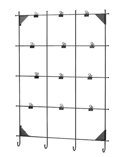 A black metal rack has clips attached to it. 