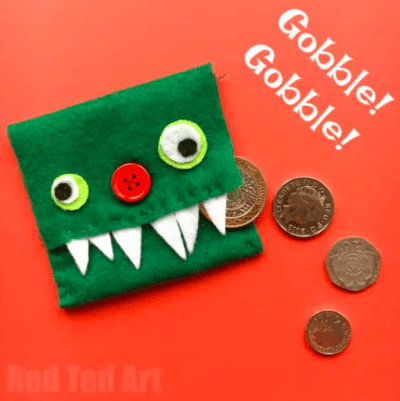 monster-change-purse A coin purse made from green felt with googly eyes, a red button nose and white felt fangs