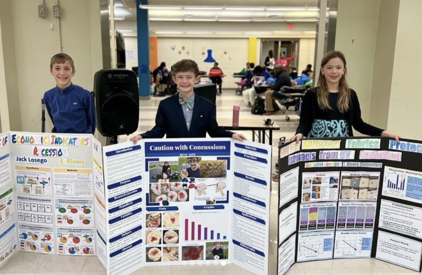 science-fair Science fair kids holding posters