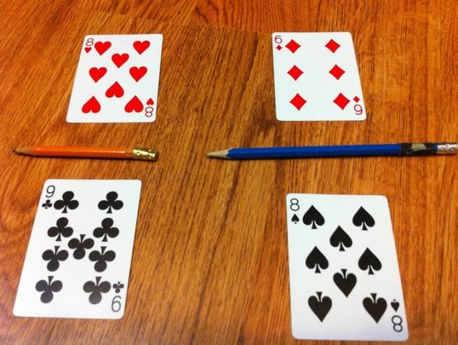 Third Grade Math Games Math File Folder Games Four playing cards laid out to represent fractions with pencils for lines
