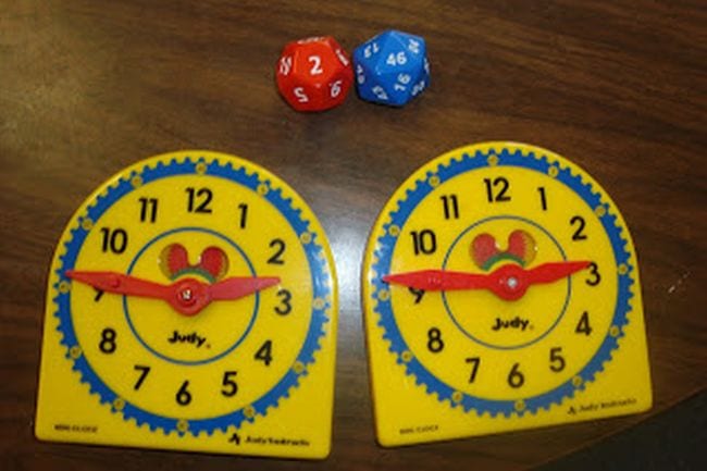 Third Grade Math Games The Elementary Math Maniac Two toy clocks and a pair of polyhedral dice