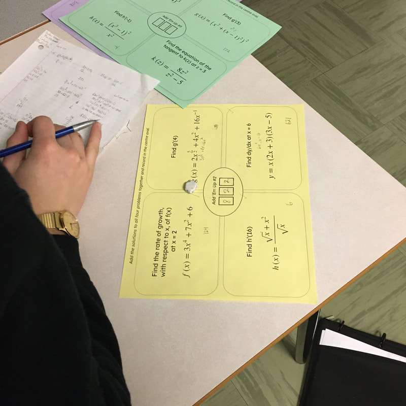 add-em-up Student writing on slip of paper