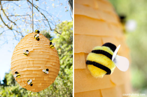 beehive-pinata A paper mache beehive with pom pom bees on it as an example of summer crafts for kids