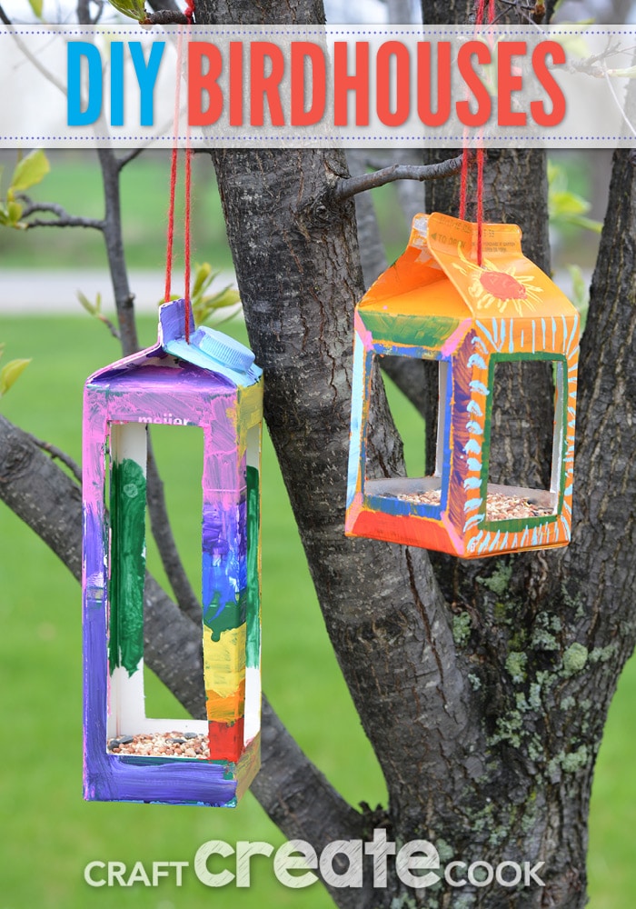 millk-carton-birdhouses Colorful bird houses made from milk cartons hang from a tree