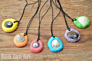 shell-pendants Colorful pendants made from shells pressed into modeling clay