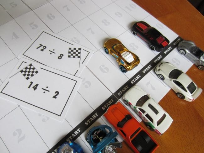 Third Grade Math Games: Division Facts Race Toy cars lined up with division flash cards