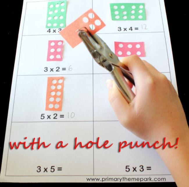 Third Grade Math Games Hole Punch Third grade math student using hole punch to learn multiplication