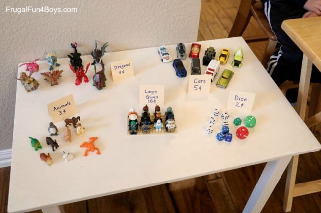 Third Grade Math Games: Multiplication Shop Table with small toys with price tags