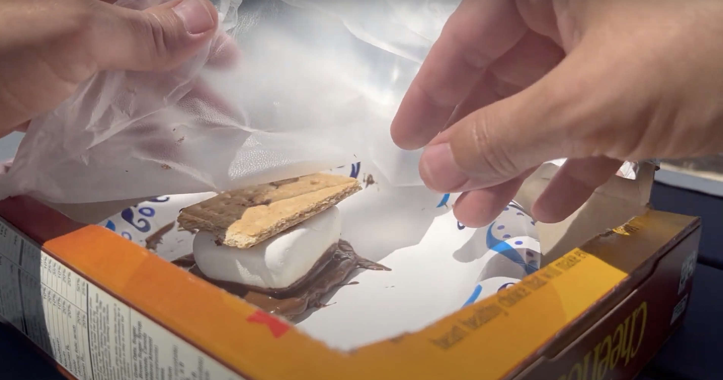 Melted s'more in cardboard box- solar oven science project