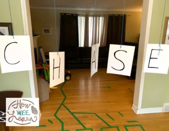 DIY Obstacle Courses for Kids: Alphabet A series of letter cards hanging from a doorway spelling out the word