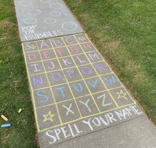 DIY Obstacle Courses for Kids: Chalk An obstacle course for kids drawn with chalk on a sidewalk, starting with a grid of letters where kids must jump to spell out their name in this example of obstacle courses for kids