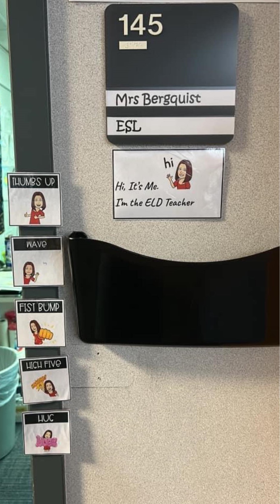 The entryway to a classroom door shows five different options for students to select from when entering. They include thumbs up, wave, hug.
